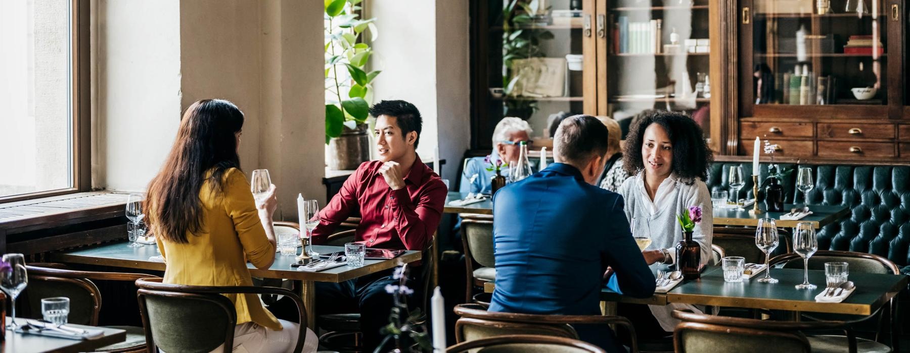 a group of people sitting at a table